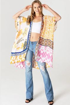 Boho kimono with bold geometric prints.Ultra light, draping open-front. Light and billowy silhouette, perfect for effortless layering. CARE | Hand Wash Cold or Dry Clean CONTENTS | 100% Viscose MEASUREMENTS | 36"/91 cm Top to Bottom (Size O/S) MODEL | 5'8 - wearing O/S IMPORTED Multicolor Printed Wrap Cover-up, Flowy Open Front Printed Cover-up, Pink V-neck Kimono For Beach Cover-up, Pink Bohemian V-neck Kimono, Multicolor Print Kimono For Spring Beach Cover-up, Pink Kimono For Beach Festival, Spring Printed Wrap Kaftan, Spring Rayon Kaftan With Kimono Sleeves, Flowy V-neck Printed Kimono