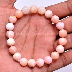 "Product Details : Item Code : DGC1100 Gemstone Name : Pink Opal Chain Style : Beaded Beads Shape : Smooth Round Beads Size : 10 MM Approx Length : 8\"Inch/ Stretchable Weight : 115 Cts. Approx Customization : **Available** Please Feel Free To Contact If You Have Any Query." Pink Opal Beaded Bracelets With Round Beads As Gift, Pink Opal Beaded Bracelets As Gift, Pink Opal Round Beads Jewelry, Pink Opal Bracelets As Gifts, Pink Round Bracelets With Polished Beads, Pink Bracelets With Polished Beads, Pink Opal Round Beads Bracelet, Beaded Beads, Yoga Bracelet