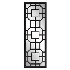 a tall black and white wall mirror with an intricate design on the bottom half of it