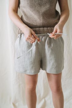 "Lilac shorts, Linen shorts, Bride shorts, Linen clothing, Beige shorts, Summer shorts, Beach linen shorts, Women linen shorts, City shorts -----------We do make custom made clothes. Just let us know your measurements ------------------- * Name: Lilac shorts * Handmade * Colour: NATURAL * 100 % washed & softened Lithuanian linen * 205 g/m2 * Pockets * Belt * Length of the shorts - 36 cm The model is 178 cm height and is wearing size S. Choose your size (your body measurements) : Size XS: US Beach Linen Pajama Shorts, Beach Linen Shorts With Short Legs, Vacation Linen Shorts With Short Inseam, Bermuda Linen Shorts For Beach, Relaxed Fit Summer Shorts, Linen Pajama Shorts For Summer, Summer Bermuda Linen Shorts, Bermuda Linen Shorts With Elastic Waistband, Summer Linen Pajama Shorts