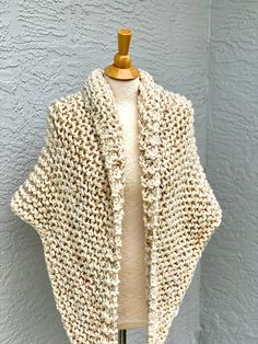 Hand knitted Outlander inspired shawl in cream blend. Wooden pin is NOT included. - triangle design, can be worn in many different ways - a small button can be attached to one of the tips, so you can secure it in the back for cross body style (if you desire a button, please include you request in a message to the seller at the check out) - super soft 90% acrylic, 10% sheep wool yarn - available in any color or yarn imaginable, please contact me for custom orders -made in smoke and pet free envir Handmade Beige Shawl One Size, Hand Knitted Beige Winter Shawl, Hand Knitted Beige Shawl For Winter, Handmade One-size Fall Wraps, Handmade Cream Shawl For Winter, Handmade Cream Shawl One Size, Cozy Crochet Shawl One Size, One Size Knit Shawl Knitting Pattern, Cozy One Size Knitting Pattern For Scarf