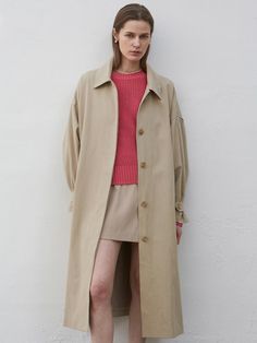 This is a hooded trench coat from NICK&NICOLE, featuring a unique design. It's a versatile piece thanks to its detachable hood.- Straps allowing for various styling options- A clean silhouette that can be achieved with hidden button details- The front pockets offering ample storage space Oversized Beige Raincoat For Fall, Oversized Khaki Parka For Spring, Oversized Fall Raincoat, Oversized Spring Parka For Workwear, Oversized Spring Workwear Parka, Oversized Beige Outerwear With Detachable Hood, Oversized Gabardine Outerwear For Fall, Spring Long Coat Parka For Workwear, Spring Workwear Parka Long Coat