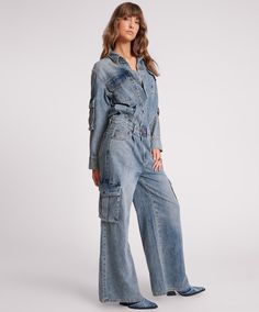 The BLUE BLOSSOM CARGO TRUCKER OVERALL is a masterpiece. At first glance it looks like a double denim delight but is a jumpsuit with a tucked in waist. Oversized with a fixed waistband that you can pull up or down depending on where you want it to sit. True to size, raw hem with inverted pleats to allow movement in the top half. Features some distressing on the back neck and some on the cuffs and finished off with gunmetal hardware.   BLUE BLOSSOM is our favourite new denim wash - a so Low Waist Skirt, Blue Blossom, Adventurous Women, Boyfriend Fit Jeans, Gunmetal Hardware, Double Denim, Jumpsuit Online, One Teaspoon, Relaxed Fit Jeans