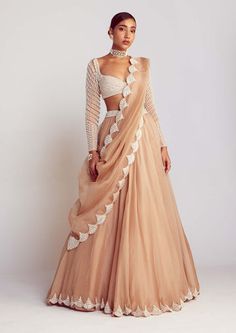 Editor's Note Radiate elegance in this captivating beige pearl embellished lehenga, perfectly complemented by a sweetheart neck pearl drop full sleeve blouse. The intricate pearl detailing adds... Beige Lehenga, Sweetheart Blouse, Vani Vats, Simple Lehenga, Trendy Outfits Indian, Organza Lehenga, Indian Outfits Lehenga, Lehenga Designs Simple, Pearl Chandelier