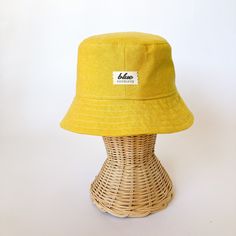 "The perfect weekend bucket hat! Made from a bright yellow linen blend fabric. This hat is very comfortable to wear. A great sun hat for women or men. I made this hat with a day of adventure in mind, somewhere sunny and wild! This hat is made from a yellow linen and cotton blend fabric. Inside liner is white cotton. Interfacing inside brim for extra shape. Brim measures approx. 2.5\" wide. Crown measures approx. 3.5\" deep. Available in sizes: S - measures 22.5\" (fits heads with circumference o Summer Linen Hat With Short Brim, Adjustable Linen Bucket Hat For Summer, Linen Summer Hat For Outdoor, Summer Linen Hat For Outdoor, Summer Sun Hat In Solid Color For Everyday, Summer Linen Straw Hat For Beach, Linen Bucket Hat For Beach, Yellow Bucket Hat For Outdoor Summer Activities, Yellow Bucket Hat For Spring Outdoor