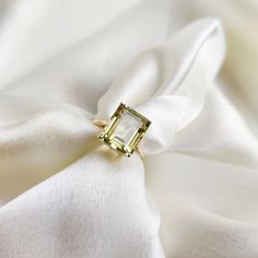 This stunning ring is set in 14k Solid Yellow Gold with Natural Lemon Topaz with utmost precision. It is an unique statement gemstone ring for nearly every occasion and is completely hassle-free jewelry. ITEM DETAILS * Gem: Lemon Topaz * Gem Size: 10X12mm * Gem Shape: Octagon  * Gem Weight: 5.81 carats * Gold Purity: 14KT * Gold Weight: 1.94 gram * Total Weight of the Ring: 3.10 gram The Gold purity is guaranteed and it comes with authentic 14KT gold hallmark. Since my items are handmade, they are absolutely nickel and lead free. CUSTOMIZATION: * Size Customization is available for this ring and it is available in all ring sizes. Kindly choose your ideal ring size from the drop-down. * Gemstone customization is available and the it can be substituted with a gem of your choice. Kindly messa Topaz Jewelry November, Octagon Ring, November Birthstone Ring, Ring Emerald Cut, Handmade Jewelry Box, Topaz Jewelry, Bezel Ring, Ring Emerald, November Birthstone