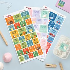 two stickers with animals and words on them next to some cotton balls, toothbrushes and other items