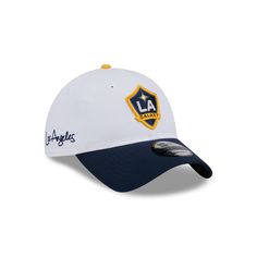 The LA Galaxy 2024 Jersey Hook 9TWENTY Adjustable Cap features an embroidered Galaxy logo at the front panels with a team script at the right-wear side and an adjustable closure at the rear. White Throwback Baseball Cap For Sports Events, White Throwback Snapback Hat For Sports, White Throwback Snapback Hat For Sports Events, White Snapback Hat With Embroidered Logo For Fans, White Adjustable Fitted Hat For Fan Merchandise, Adjustable White Fitted Hat For Fan Merchandise, White Adjustable Fitted Hat For Fans, Adjustable White Fitted Hat For Fans, White Visor Fitted Hat For Fan Gear