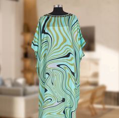 "Long Hand Embellished Silk Kaftan Silk Dress For Women One size fits most Material :- Silk  👉size Small  to 8XL 👈 Length 60\" and 43\" Width, Around 86\" This beautiful print Kaftan is handmade made from high-quality silk. This unique style of Silk Kaftan and the delicate pattern on it, makes it perfect for you to get ready for your big day- with style and comfort! Wash - Hand wash Free Shipping" Green Silk Floor-length Kaftan, Green Silk Tunic Kaftan, Spring Silk Kaftan With Abstract Print, Green Long Printed Kaftan, Green Printed Free-size Kaftan, Green Printed Free Size Kaftan, Green Abstract Print Maxi Dress For Beach, Green Maxi Dress With Abstract Print For Beach, Bohemian Silk Kaftan With Abstract Print