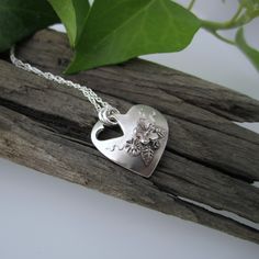 A little smaller than my normal range, these gorgeous little hearts make beautiful gifts for bridesmaids, florists and flower lovers everywhere! A fabulously intricate heart shaped pendant with tiny hand sculptured flowers. The little heart is slightly domed to sit beautifully on the wearer and comes with a complimentary sterling silver chain. Each flower, leaf and tendril is lightly oxidised and then polished to bring out the minute detail. The edges are also polished to catch the light.  PLEAS Forest Necklace, Gifts For Bridesmaids, Fire Blue, Cherry Necklace, English Country Garden, Blue Opal Necklace, Silver Flower Necklace, Heart Shaped Pendant, Hand Sculpture