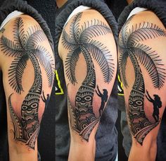 this is an image of a man with a palm tree tattoo on his arm and shoulder