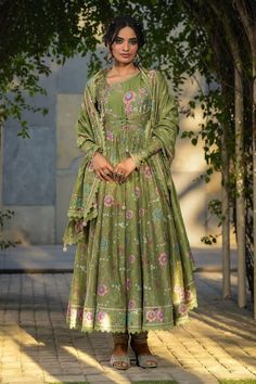 Dark green silk chanderi koti jacket style anarkali with all over floral prints and embroidery detailing. Paired with a churidar and dupatta with floral prints and lace border. - Aza Fashions Partially Stitched Green Anarkali Set With Straight Kurta, Green Chanderi Maxi-length Dupatta, Green Chanderi Maxi Length Dupatta, Green Anarkali Dupatta For Transitional Season, Green Art Silk Anarkali Set, Transitional Green Anarkali Set In Art Silk, Green Silk Floor-length Kurta, Green Floor-length Silk Kurta, Unstitched Green Silk Anarkali Set