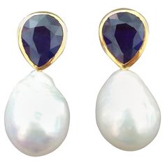 These simple chic and handmade stud earrings have a pair of Faceted Pear Shape Blue Sapphires measuring 9 x 11 mm and weighing 9,5 carats set in solid 14 Kt. yellow gold bezel on the top and in the lower parts 2 excellent luster White Pear Shape Baroque Pearls measuring 14x18 mm and weighing 51 Carats. In 1978 our workshop started in Italy to make simple-chic Art Deco style jewellery, completely handmade and using the typical gemstones of that period (1920-1930 circa) : genuine Jades, Turquoise Chic Art, Simple Chic, Pearl Stud Earrings, Pearl Studs, Blue Earrings, Baroque Pearls, Pear Shape, Jewelry Earrings Studs, Pear Shaped