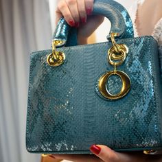 The Amina Teal Handbag goes with literally everything. From Jeans, Office wear, dinner wear, evening gowns, cocktail dress, you name it. The square shaped bag with its gold key chain embellishment to elevate that outfit. Name the occasion, Brunch? Date Night? Weddings? Business Conferences? Casual Events?. Tons of ways to style the AMINA Handbags. Product Details Tote Bag Metal lock detail Key chain Removable adjustable shoulder strap Inner compartment Gold handle design Satin Inner lining Measu Elegant Evening Box Bag With Dust Bag, Party Box Bag With Detachable Top Handle, Rectangular Box Bag For Party With Dust Bag, Luxury Gold Top Handle Evening Bag, Elegant Shoulder Bag With Chain Strap As Gift, Luxury Evening Bag With Top Handle For Events, Luxury Evening Bag With Handle Drop For Events, Luxury Box Bag With Detachable Strap For Party, Luxury Evening Box Bag With Detachable Handle