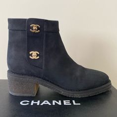 Chanel Black Suede Calfskin Short Boots, Size 38, Fits 7 1/2-8, Champagne Gold Signature Turn-Lock Buckle Side Openings, Pull Tab Inside Seam Zippers, 5” Shaft, 2” Heel, 1/2” Platform, Crepe Sole, (Note- It’s The Nature Of Dyed Crepe Soles To Be Uneven In Color, You Can Polish Them To Make Them Even-Colored But The Raw Material Is The Intended Look) New In Box With Dust Bags Designer Boots With Contrasting Heel Counter, Designer Suede Boots For Work, Luxury Suede Boots For Workwear, Luxury Suede Ankle Heeled Boots, Luxury Black Suede Boots, Black Boots Chanel, Chanel Moto Boots, Chanel Black Ankle Boots, Chanel Ankle Boots