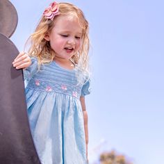 This lovely short-sleeved dress is made from high quality linen with beautiful blue sky color fabric. It has intricate hand smocking from shoulder to chest with embroidered little flowers. Comfortable, perfect for everyday wear as well as formal occasion. *  High quality linen cotton *  100% Handmade *  Tie at the back *  Lightweight, comfortable, and ready to play *  Hand wash or machine wash on a delicate setting We are based in Sydney, New South Wales, Australia. Within Australia, Standard sh Hand Smocking, Beautiful Blue Sky, New South Wales Australia, Hand Smock, Sky Color, Different Dresses, Dress Out, Green Floral Dress, Smocked Dress