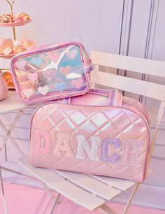 Steal the spotlight with this pastel pink quilted metallic 'DANCE' duffle bag detailed with pink pastel glitter varsity letter applique patches! They'll twirl with delight as they bring this dazzling bag to practices and competitions all season long! Measures Approx. -10.625”H x 16.375”W x 7.25”DManufacturer Style No. - DNC-SDB369 Letter Applique, Pink Duffle Bag, Varsity Letter, Applique Patches, Glam Bag, Steal The Spotlight, Types Of Buttons, Pink Pastel, Large Backpack