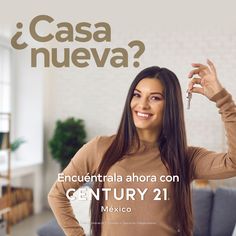 a woman holding a key in her hand and standing next to a couch with the caption's name written on it