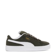 A fresh take on the classic Suede—this PUMA Suede XL is one for the wearing. Featuring an exaggerated padded collar tongue, a chunkier sole, and thick laces, this execution is inspired by the 00s but made for the modern day. A full suede upper plus a leather Formstrip make this classic, durable, and ready for everyday looks.Features: Full suede upper with leather Formstrip. Exaggerated padded collar and tongue. Mesh insole with multiple screen-printed PUMA logo. Thick laces for a throwback look. Classic Sneakers With Padded Tongue For Sports, Classic Puma Sneakers For Streetwear, Casual Green Puma Sneakers, Casual Sneakers With Padded Tongue For Streetwear, Casual Green Sneakers For Winter, Casual Green Winter Sneakers, Casual Sneakers With Padded Tongue For Sports, Casual Mid-top Sneakers With Padded Tongue, Green Sporty Sneakers