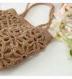 IN STOCK FAST SHIPPING FROM LOS ANGELES Artfully designed for your summertime getaways, the Elena Handbags Floral Design Straw Beach Tote adds a touch of charm and elegance to any beachwear ensemble. Crafted from lightweight straw and woven with intricate floral designs, this bag is the perfect companion for yoga, the market place, and, of course, the beach. Elegant and tasteful, this sophisticated tote is sure to turn heads. Size is approximately 28cm wide x 25cm tall (11in x 10in) Designer Sty Spring Beach Sand-colored Straw Bag, Summer Woven Sand-colored Shoulder Bag, Chic Lightweight Crochet Bag For Summer, Sand-colored Straw Bag For Summer Beach, Chic Summer Beach Straw Bag, Bohemian Beige Shoulder Bag For Beach Season, Beachy Beige Shoulder Bag For Beach Season, Bohemian Beige Shoulder Bag For The Beach, Summer Beach Straw Bag For Vacation