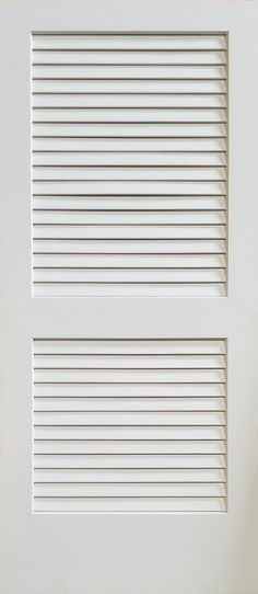 a white door with shutters on the outside and side panels in the top half