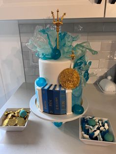 a cake with blue and gold decorations on it