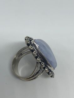 great color blue Lace agate stone The setting is handcrafted in low content silver About an inch long Size 7.5 Can be sized. My jeweler charges between $10-$15. All rings are shipped in a nice gift box. Check out our over a THOUSAND great reviews Engraving is $4 per letter and is not always perfect depending on the piece. It can take a few days if the jeweler is busy. This is payable to Paypal Judithsltd@gmail.com Adjustable Chalcedony Jewelry For Anniversary, Blue Oval Agate Jewelry, Blue Amethyst Gemstone Ring Gift, Oval Blue Agate Jewelry, Adjustable Blue Opal Gemstone Ring, Adjustable Blue Rings With Large Stone, Formal Blue Handmade Gemstones, Blue Opal Spiritual Ring For Gift, Blue Rings With Large Stone For Healing