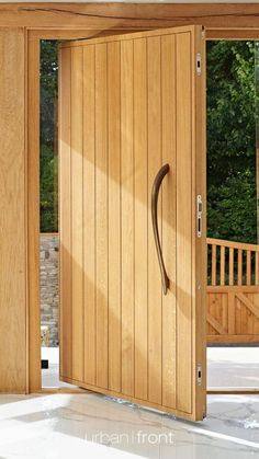 an open wooden door in the middle of a room