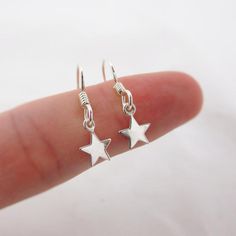 SOLID STERLING SILVER EARRINGSThese celestial earrings make a wonderful gift. The real sterling silver ear hooks are adorned with a tiny star (also 925 sterling silver). Comes in a gift box, perfect for gift giving. Total earring length is just under 1 inch long. ALSO AVAILABLE IN A MOON DESIGN OR MOON/STAR COMBO Silver Moon Earrings, Sterling Silver Star Earrings, Star Dangle Earrings, Silver Star Earrings, Celestial Earrings, Moon And Star Earrings, Turquoise Bead Necklaces, Tiny Star, Turquoise Rings