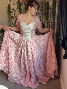 The Elain gown inspired from the Acotar series.  Made with satin rosette fabric and a satin and brocade bodice. Also has a corset back for size inclusivity.  Size measurements are as follows: Small: height: 5'7"  bust: 34" waist: 30" Medium: height: 5'7" bust: 38" waist: 34" Large: height: 5'7" bust: 42" waist: 37" XL: height:  5'7" bust: 48" waist: 42" Fitted Gown With Lined Bodice For Quinceanera, Fitted Lace Bodice Gown For Quinceanera, Quinceanera Fitted Bodice Ball Gown, Princess Gown With Sweetheart Neckline, Taffeta Dress With Fitted Bodice, Floor-length, Fitted Bodice Taffeta Dress For Prom Season, Princess Style Fitted Gown For Quinceanera, Princess-style Fitted Gown For Quinceanera, Fitted Pink Dress With Underbust Shape