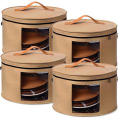 three round storage containers with lids and handles