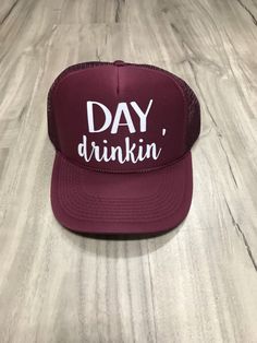 "Day Drinkin' Trucker Hat 100% Polyester Foam Front, Soft Mesh Back, Structured, Mid-profile, 3.5\" Crown, Five-panel with braid, Plastic Tab Closure. One Size. Please let us know if the note section what color print you would like on your hat. We have almost every color glitter and regular vinyl as well as gold and silver foil. The color you select in the drop down menu is the color of the hat. If you do not leave a note for the print color choice, we will select the default color for you. All Fun Snapback Hat With Curved Brim For Parties, Adjustable Flat Brim Trucker Hat For Party, Adjustable Curved Brim Snapback Hat For Party, Party Snapback Hat With Curved Brim, Party Trucker Hat Baseball Cap Adjustable, Party Snapback Trucker Hat With Letter Print, Party Trucker Hat With Letter Print, Brimmed Trucker Hat For Vacation, Summer Vacation Trucker Hat