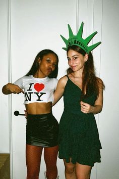 two girls dressed up as the statue of liberty