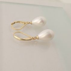 Teardrop Pearl Earrings Ivory White Pearl Earring for Women | Etsy Mexico Elegant Pear-shaped Earrings For Formal Occasions, Elegant Gold Pear-shaped Bridal Earrings, Elegant Pear-shaped Earrings For Party, Classic White Pear-shaped Teardrop Earrings, Elegant Hypoallergenic Earrings For Formal Events, Elegant Hypoallergenic Earrings For Formal Occasions, Elegant Gold Pear-shaped Earrings, Elegant White Teardrop Earrings, Delicate White Teardrop Earrings