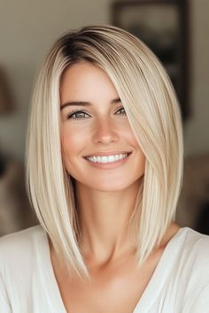 Save this pin for the best fall hair colors for blondes. This icy platinum shade transforms any look into a chic statement. The sleek finish enhances the glossy platinum shade, making it shine even more. Side Part Blonde Bob, Hair For 40 Year Old Women, Mid Length Haircut Straight, Blond Haircuts, Long Bob Fine Hair, Platinum Blonde Hair With Lowlights, Winter Blonde Hair Color, Blonde Shoulder Length Hair, Style Medium Hair