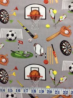 a gray fabric with sports related items on it