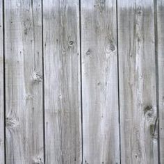 an old wooden fence is painted white