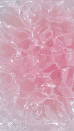 the water is pink and has bubbles in it