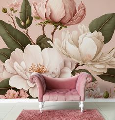 a pink couch in front of a floral wall mural