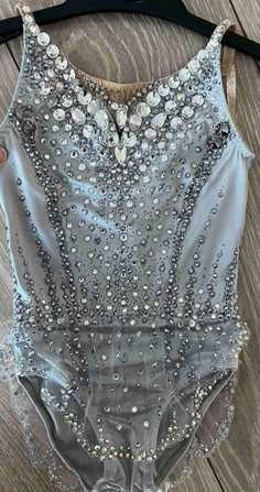 a woman's bodysuit with sequins on it