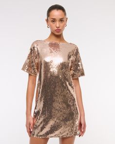 Flattering short-sleeve shift mini dress in our small stretch sequin fabric, featuring an open back with cross-back bar detail and crew neckline. Bar Detail, Shift Mini Dress, Sequin Tee, Sequin Fabric, Mini Shift Dress, Women's Dresses, Abercrombie Fitch, Crew Neckline, Jumpsuit Dress