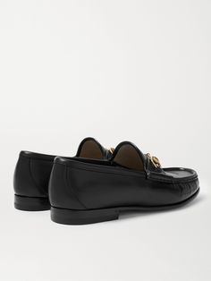 Gucci's iconic loafers were first introduced in 1953; it says a lot about the timelessness of the design that they've barely changed since. This glossy black version has been crafted in Italy from leather embellished with the hallmark horsebit that nods to the brand's equestrian heritage.