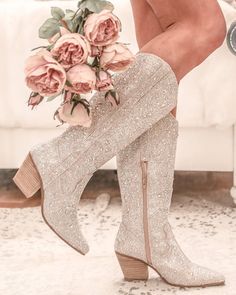 a pair of boots with flowers on the heel are featured in this instagramted post