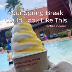 an ice cream sundae sitting next to a swimming pool