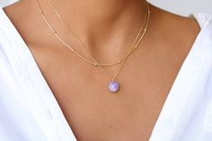 This necklace is handcrafted with much love and hight quality Amethyst. In each stone, you can see the beautiful colors of genuine  Amethyst. This dainty necklace features one genuine Amethyst pendant placed on a dainty 18k gold-filled chain.  Please note: this listing is for one necklace only. The model in the pictures is layering it with some of our beautiful accept chains and a Raw Amethyst necklace. Layer it too and take your outfit to the next level!   G E M S T O N E  February Birthstone: Dainty Lavender Amethyst Jewelry, Dainty Amethyst Jewelry With Adjustable Chain, Dainty Lavender Birthstone Jewelry, Lavender Dainty Birthstone Jewelry, Elegant Everyday Amethyst Necklace, Dainty Faceted Amethyst Jewelry, Elegant Amethyst Jewelry With Adjustable Chain, Lavender Gemstone Beaded Necklace For Gift, Delicate Amethyst Birthstone Jewelry