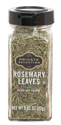 rosemary leaves in a glass jar on a white background with the label private selection rosemary leaves