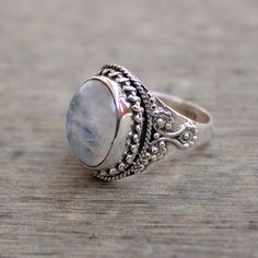 Gemstone - Natural Rainbow Moonstone Gemstone Size - 12x16 mm oval Metal - Sterling Silver natural AAA rainbow moonstone set with a sterling silver handmade ring Each Ring made with Precision and love, these rings are perfect for everyday use and a perfect accessory to wear at work. Rings can be customized on request and gemstone can be switched to any other as per requirement. Other beautiful designs uploaded with fabulous gemstones. kindly visit my store to view the complete collection. Feel f Adjustable Oval Moonstone Ring For Weddings, Adjustable Oval Moonstone Wedding Ring, Bohemian Silver Moonstone Cabochon Ring, Bohemian Silver Oval Cabochon Moonstone Ring, Bohemian Silver Moonstone Ring In Oval Cabochon, Bohemian Silver Moonstone Ring With Oval Cabochon, Silver Oval Moonstone Ring With Natural Stones, Dainty Handmade Oval Moonstone Ring, Unique White Oval Moonstone Ring