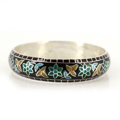 Flower Pattern Enamel Bangle for women, Floral Bangle, One of Kind Bangle, Top Trending Enamel Bangle, Meenakari Bangle from India, Product Details : Metal : 925 Solid Sterling Silver Designer Enamel Bangle inspired by nature. Bangle Width : 14 mm Approx Bangle Inner Diameter : 62 mm Approx Bangle Weight : 36.300 Grams Approx Style :  Enamel Jewelry  Note : All the enamel is hot enamel and purely handmade, if it falls from height there may be chance of breakage in enamel. All the designs are crafted by londonjewellers, its our original designs and mostly of them are ready in the stock, we are using Pure 925 (Stamped) Sterling Silver with Gemstones, our jewelry designs are Handmade. We are adding new creative designs in our shop regularly, for new handmade stuff please visit our shop : http Bohemian Meenakari Bangle, Meenakari Jewelry Bracelet, Ceremonial Cuff Bracelet For Festivals, Ceremonial Festival Cuff Bracelet, Traditional Flower Shaped Bracelets, Silver Meenakari Bangle Bracelet, Elegant Multicolor Enamel Bangle, Elegant Bangle Bracelet With Inlay, Traditional Flower Shaped Jewelry