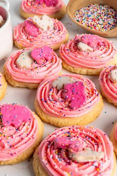 pink frosted cookies with sprinkles and marshmallows