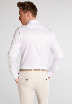 SLIM FIT Luxury Shirt - Soft handle, even texture and fine sheen. The stylish choice for a clean, elegant premium look. Premium shirt with a soft feel, which is characterized by a particularly fine and fabric with an elegant sheen. Smooth, dense and evenly woven, it lets its wearer shine on every occasion. The two-ply twill fabric made of 100% cotton in two layers is characteristic of the premium shirt "Luxury Shirt". The fabric is smooth, tightly and evenly woven. This high-quality garment is d Elegant Long Sleeve Dress Shirt For Daywear, Elegant Tailored Shirt With Concealed Placket, Elegant Shirt With Concealed Placket, Elegant Shirt With Concealed Placket And Spread Collar, Luxury Fitted Shirt For Daywear, Luxury Fitted Daywear Shirt, Elegant Tailored Semi-formal Tops, Elegant Shirt With Hidden Button Closure And Spread Collar, Elegant Dress Shirt With Spread Collar For Daywear